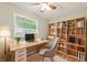 Dedicated home office with custom shelving, natural light, and ample storage for a productive workspace at 7928 Vontress St, Coatesville, IN 46121