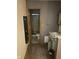 Bathroom featuring a toilet, shower, sink, and vanity cabinet offering a functional and practical space at 8312 Lamira Ln, Indianapolis, IN 46234