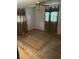 A bedroom featuring hardwood floors, ceiling fan, and windows with curtains providing ample natural light at 8312 Lamira Ln, Indianapolis, IN 46234