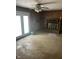 Empty living room featuring french doors, a ceiling fan, and a fireplace at 8312 Lamira Ln, Indianapolis, IN 46234