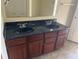 Bathroom with double vanity and large mirror at 847 Sylvan St, Whiteland, IN 46184