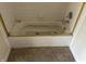 Bathroom features a white tiled tub and shower combo at 847 Sylvan St, Whiteland, IN 46184