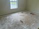 Bedroom featuring a window with view and damaged flooring at 847 Sylvan St, Whiteland, IN 46184