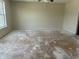 Spacious bedroom with a large window and ceiling fan at 847 Sylvan St, Whiteland, IN 46184