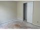 Empty bedroom showing damaged floor and white closet door at 847 Sylvan St, Whiteland, IN 46184