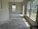 Open living room with multiple windows providing natural light and a view at 847 Sylvan St, Whiteland, IN 46184