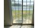 Sliding glass doors with a view of the serene lake and backyard at 847 Sylvan St, Whiteland, IN 46184