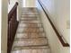 Image of a staircase with wood railing leading to the next floor at 847 Sylvan St, Whiteland, IN 46184