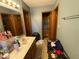 Bathroom showcasing a double sink vanity with multiple mirrors and wood framed doors at 902 St Andrews Dr, Avon, IN 46123