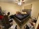 Bedroom featuring a bed and ceiling fan with an open window for natural light at 902 St Andrews Dr, Avon, IN 46123