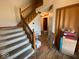 Inviting foyer with hardwood floors and a staircase leading to the upper level at 902 St Andrews Dr, Avon, IN 46123