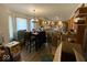 Open concept kitchen featuring a large dining table set, stainless appliances and natural light at 902 St Andrews Dr, Avon, IN 46123