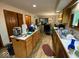 Functional kitchen with wood cabinets, ample counter space and connection to dining area at 902 St Andrews Dr, Avon, IN 46123