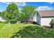 Beautiful backyard featuring a well-maintained lawn and a wooden deck, perfect for outdoor entertaining at 9055 Glass Chimney Ln, Fishers, IN 46037
