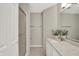 Bright bathroom featuring a walk-in shower with glass door and a vanity with a granite countertop at 9055 Glass Chimney Ln, Fishers, IN 46037