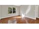 Bedroom with hardwood floors and a large window at 9055 Glass Chimney Ln, Fishers, IN 46037