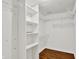 Walk-in closet with built-in shelving and hanging rods for optimal storage at 9055 Glass Chimney Ln, Fishers, IN 46037