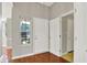 Welcoming entryway featuring hardwood floors, a window for natural light, and access to other rooms at 9055 Glass Chimney Ln, Fishers, IN 46037