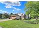 Charming home with a well-manicured lawn, mature trees, and a brick-accented two-car garage at 9055 Glass Chimney Ln, Fishers, IN 46037
