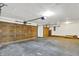 Large two-car garage with plenty of room for storage and organization, featuring a concrete floor at 9055 Glass Chimney Ln, Fishers, IN 46037