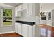 Bright eat-in kitchen with white cabinets and black granite countertop at 9055 Glass Chimney Ln, Fishers, IN 46037