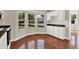 Bright eat-in kitchen featuring white cabinets, black countertops, and a bay window at 9055 Glass Chimney Ln, Fishers, IN 46037