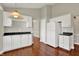 Bright kitchen with white cabinets, dark countertops, and modern refrigerator at 9055 Glass Chimney Ln, Fishers, IN 46037