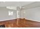 Spacious living room with hardwood floors and views into the kitchen at 9055 Glass Chimney Ln, Fishers, IN 46037