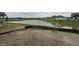 Scenic view of a pond and open green space in the backyard of a new home construction at 9125 Steinbeck Ln, Indianapolis, IN 46239