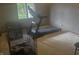 Home exercise room with modern treadmill, animal kennels and natural light from a window at 920 Corey Ln, Plainfield, IN 46168