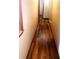 Hallway featuring dark laminate floors and neutral painted walls at 920 Corey Ln, Plainfield, IN 46168