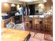 Traditional kitchen with wooden cabinets, stainless steel appliances, and a cozy dining area at 920 Corey Ln, Plainfield, IN 46168