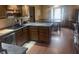 Spacious kitchen featuring hardwood floors and a breakfast nook with a table set for dining at 920 Corey Ln, Plainfield, IN 46168