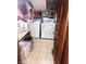 Laundry room with washer, dryer, and storage space for cleaning supplies at 920 Corey Ln, Plainfield, IN 46168