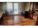 Bright living room with hardwood floors, offering a cozy view of the screened-in porch and backyard at 920 Corey Ln, Plainfield, IN 46168