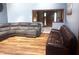 Cozy living room featuring a sectional sofa and laminate wood flooring at 920 Corey Ln, Plainfield, IN 46168