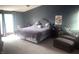 Serene bedroom with a large bed, natural light, and comfortable seating area at 920 Corey Ln, Plainfield, IN 46168