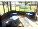 Relaxing sunroom with comfortable seating and bright, patterned rug at 920 Corey Ln, Plainfield, IN 46168