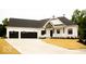 Charming home featuring a black roof, white siding, and a spacious three-car garage at 10101 - Lot 2 N Alford Rd, Fortville, IN 46040