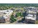 Stunning aerial view of a city center featuring modern buildings, tree-lined streets, and a central plaza at 10113 Gallop Ln, Fishers, IN 46040