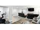 Finished basement with a media area, a workout area with an exercise bike, and neutral walls and flooring at 10113 Gallop Ln, Fishers, IN 46040
