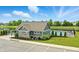 Community pool area with a pool house, lounge chairs, landscaping, and parking at 10113 Gallop Ln, Fishers, IN 46040