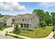 Charming two-story home with a manicured lawn, showcasing its appealing curb appeal on a sunny day at 10113 Gallop Ln, Fishers, IN 46040