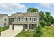 Charming two-story home with a well-manicured lawn and attached two-car garage in a lovely neighborhood at 10113 Gallop Ln, Fishers, IN 46040