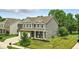 Beautiful two-story home with brick and siding exterior, attached garage, and well-maintained lawn on a corner lot at 10113 Gallop Ln, Fishers, IN 46040