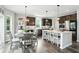 Spacious kitchen with stainless steel appliances, granite countertops, and a cozy breakfast nook at 10113 Gallop Ln, Fishers, IN 46040