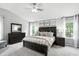 Spacious main bedroom with vaulted ceilings, modern decor, and neutral colors offers a relaxing retreat at 10113 Gallop Ln, Fishers, IN 46040