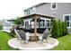 An inviting outdoor space with a covered pavilion, fire pit, and seating area perfect for gatherings at 10113 Gallop Ln, Fishers, IN 46040