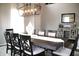 Elegantly decorated dining room with a large table, chairs, chandelier, and decorative accents at 10113 Gallop Ln, Fortville, IN 46040