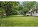 Expansive, tree-lined backyard offering a peaceful retreat with ample space for recreation and relaxation at 110 Leichester Ct, Noblesville, IN 46060